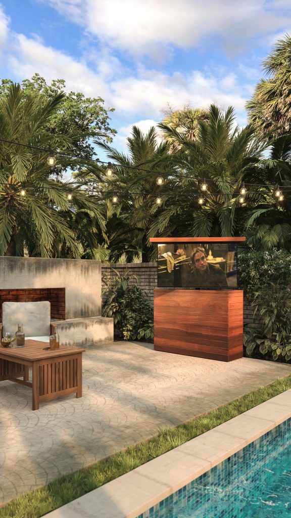 An outdoor hidden TV lift cabinet, in natural IPE, perfect to watch your favorite sports or movies poolside.