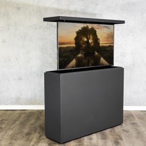 An outdoor hidden TV lift cabinet in all metal clad, river stone color, to watch your favorite sport or movie in your outdoor living space.