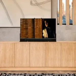 The BALLARD Hidden TV Lift cabinet is shown in a modern high-end apartment.