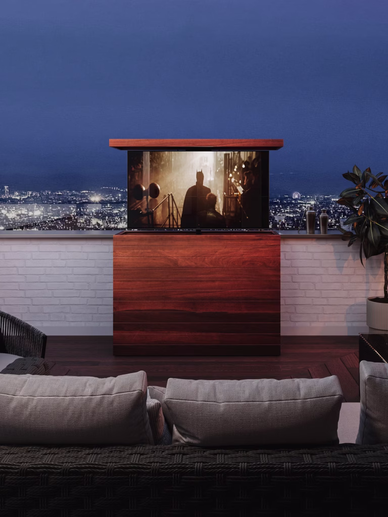 An outdoor hidden TV lift cabinet, in natural IPE, perfect to watch your favorite sport or movie on your balcony or terrace.